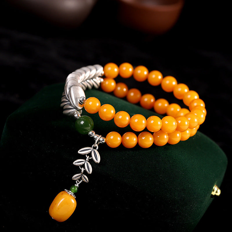 Radiant Honey Amber Bracelet with Silver Leaf Charm