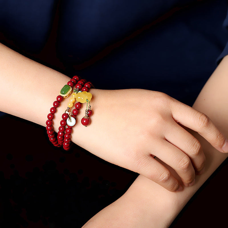 Elegant Red Sandstone Bracelet with Jade Charms