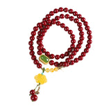 Elegant Red Sandstone Bracelet with Jade Charms