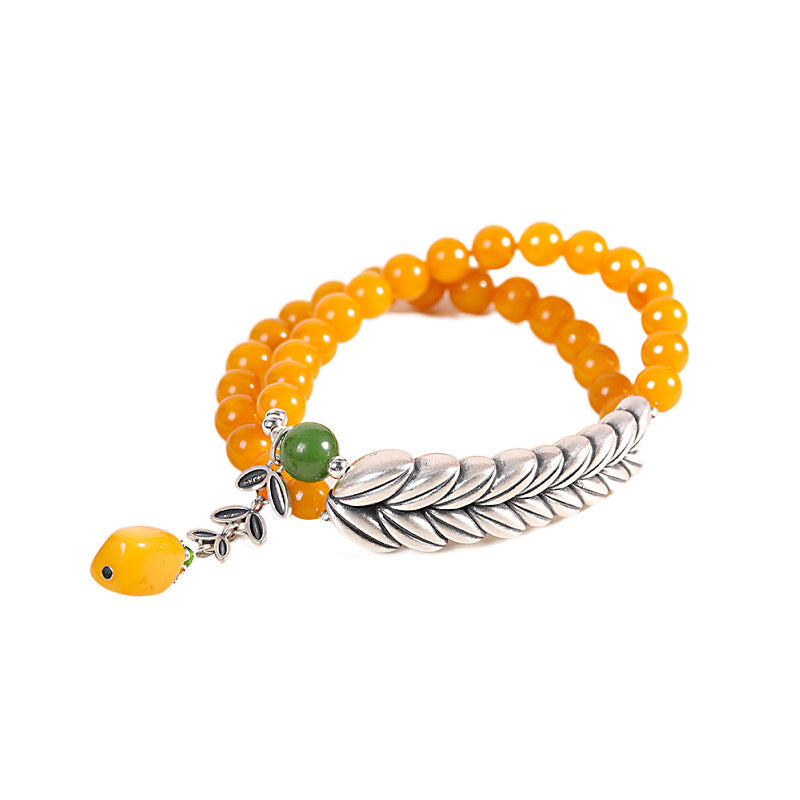 Radiant Honey Amber Bracelet with Silver Leaf Charm