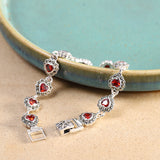 Vintage Garnet Heart Silver Bracelet, Timeless Elegance