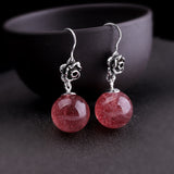 Elegant Silver Rose Earrings with Red Gem