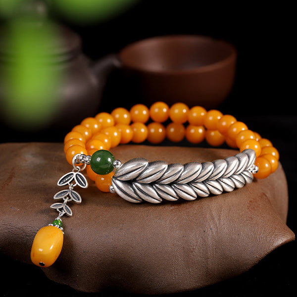 Radiant Honey Amber Bracelet with Silver Leaf Charm