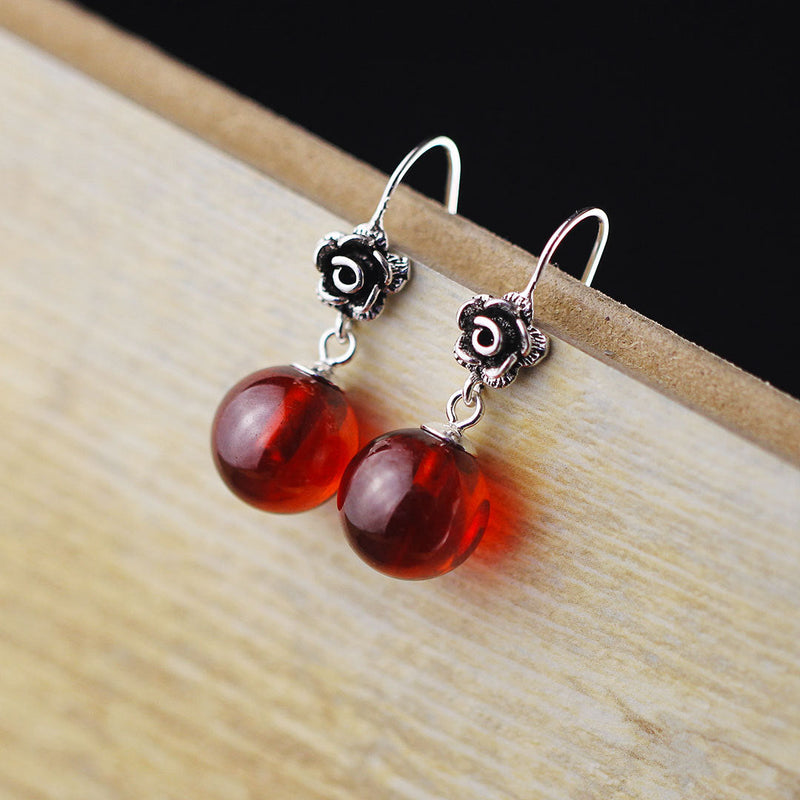 Elegant Silver Rose Earrings with Red Gem