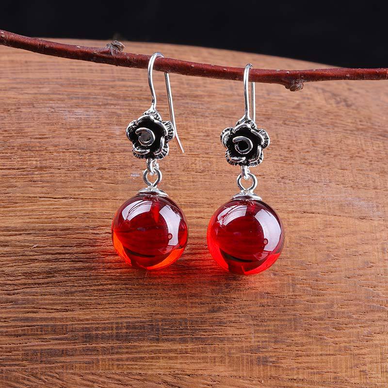 Elegant Silver Rose Earrings with Red Gem